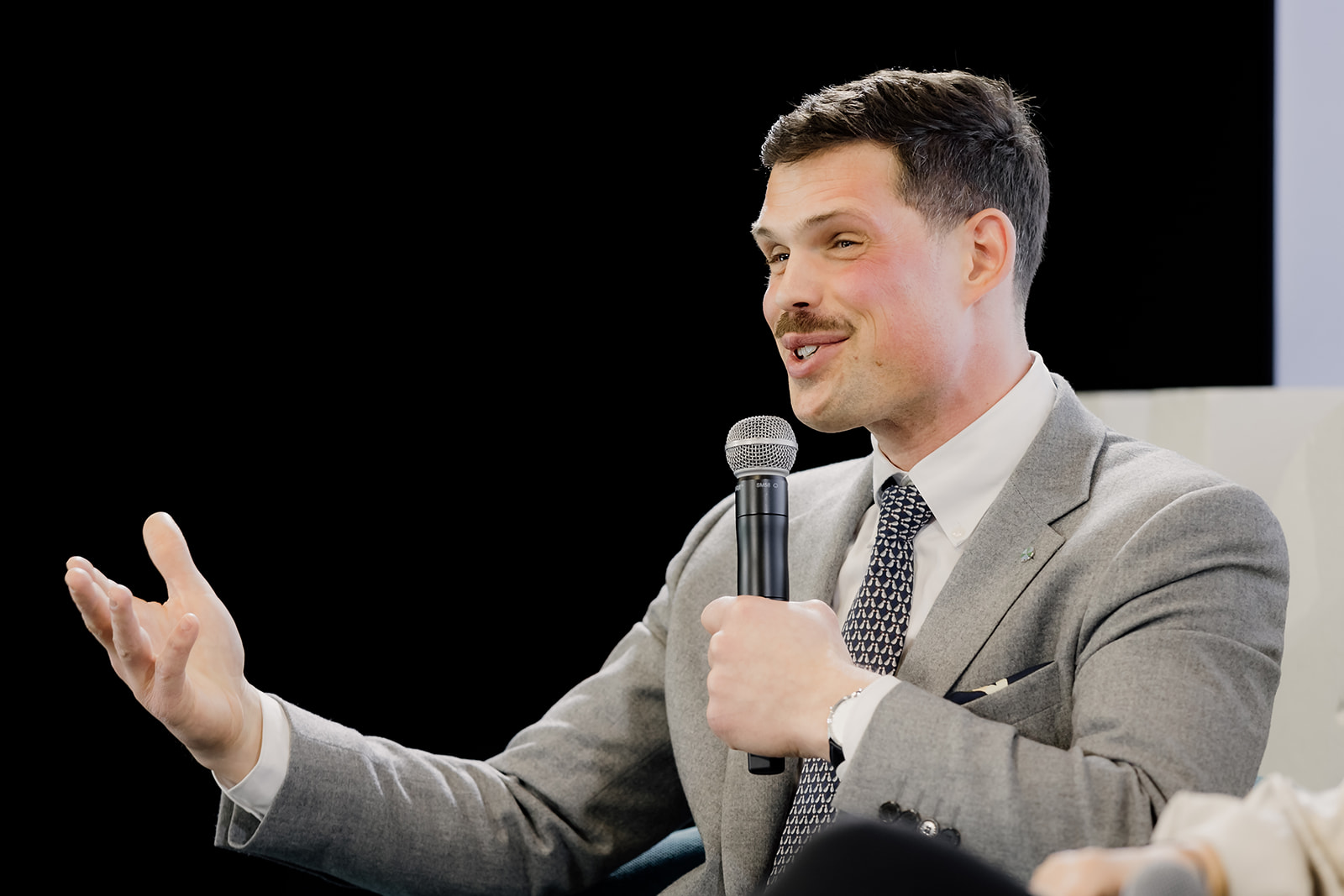 Matthieu Savi speaking at an event